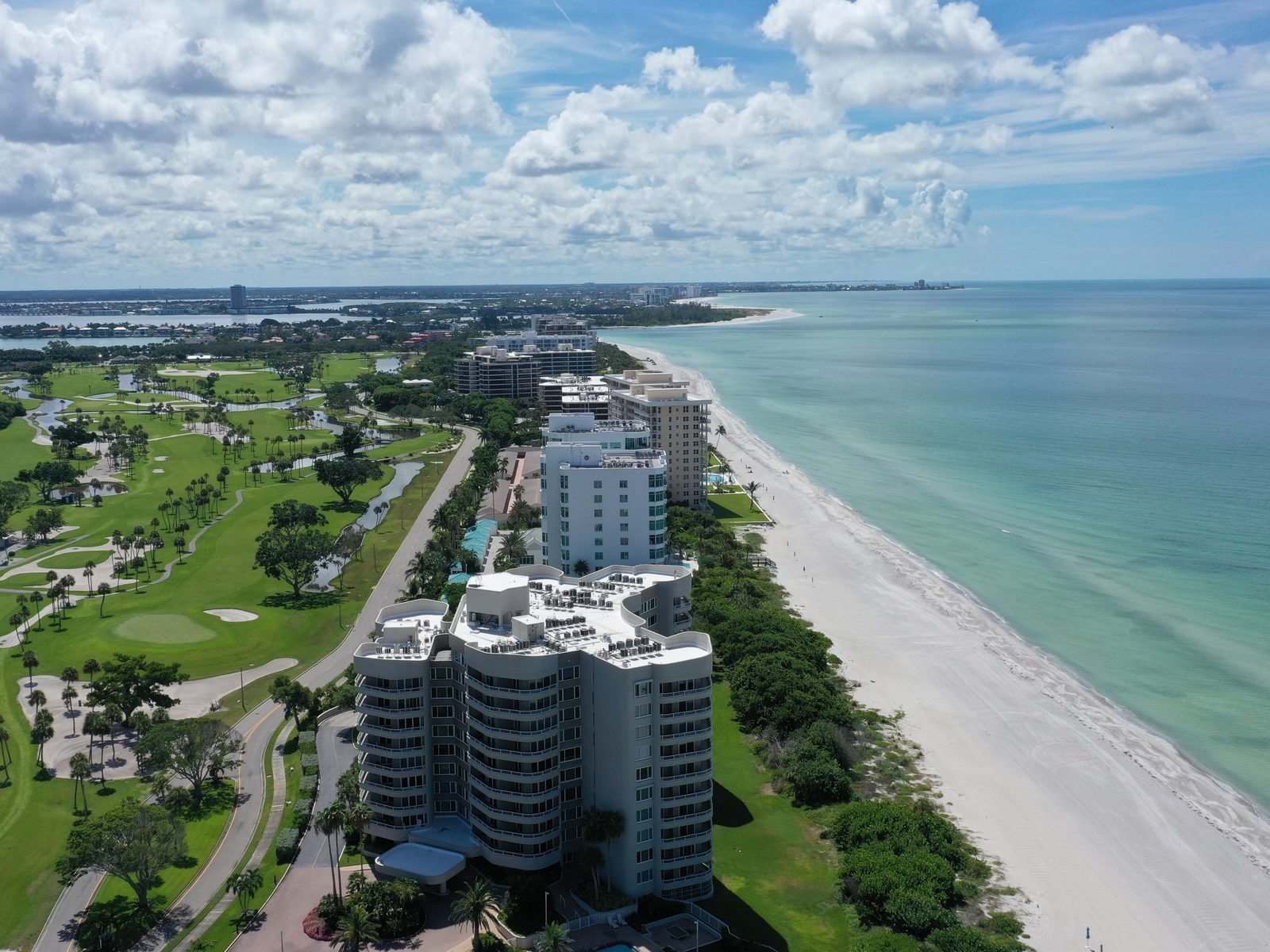 The Gulf beach and Longboat Key Club towers a short walk from Country Club Shores, golf course inland